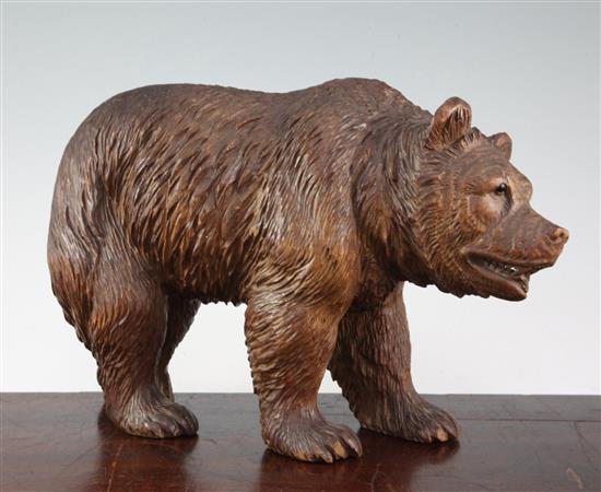 A Swiss Black Forest carved model of a standing bear, 12in.